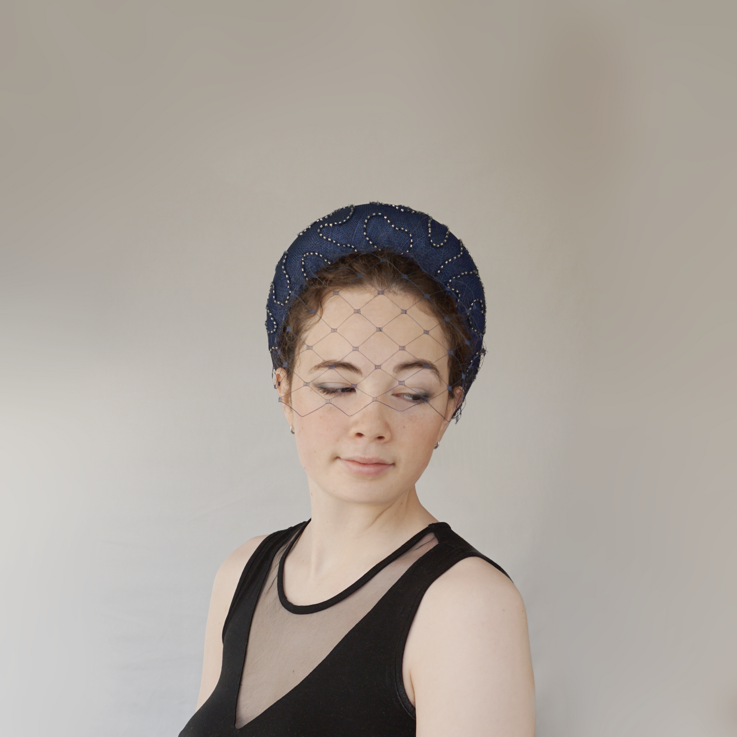 Navy Straw Wedding Guest Headband with silver beaded overlay.